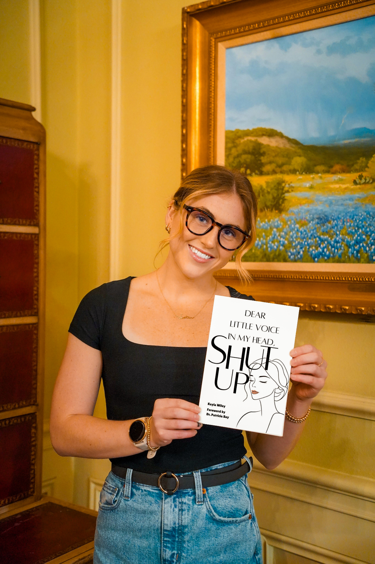 Kayla holding her book